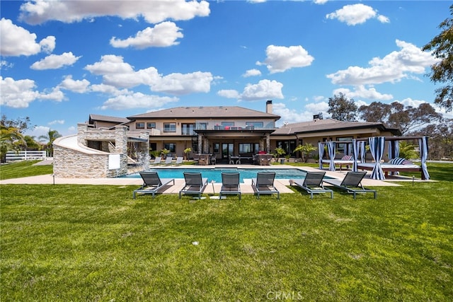 rear view of house with a yard