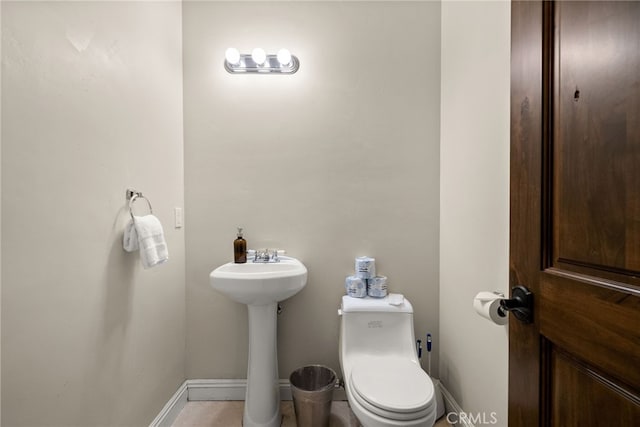 bathroom with sink and toilet