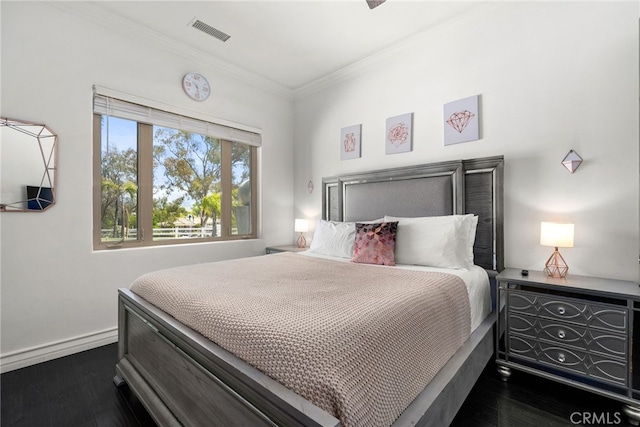 bedroom featuring dark hardwood / wood-style flooring and crown molding