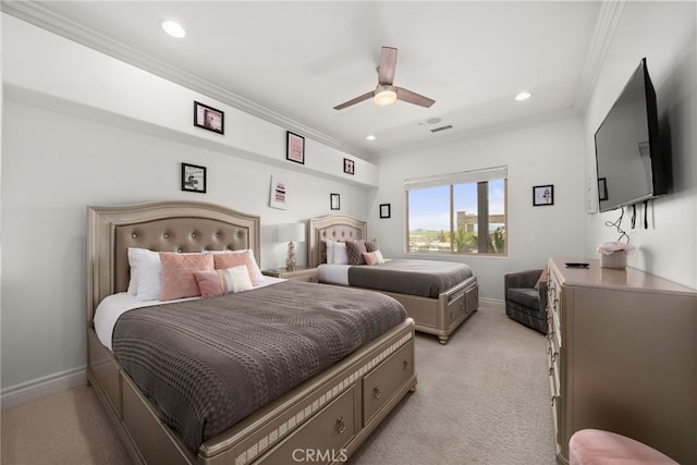 carpeted bedroom featuring ceiling fan and ornamental molding