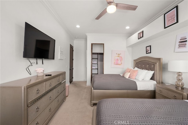 carpeted bedroom with ceiling fan and ornamental molding