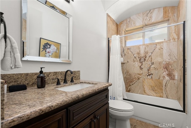 full bathroom featuring shower / bath combo with shower curtain, vanity, and toilet