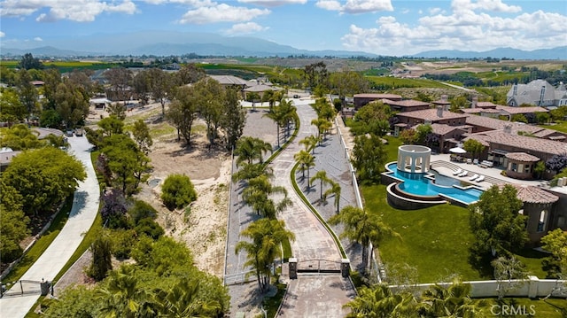 birds eye view of property featuring a mountain view