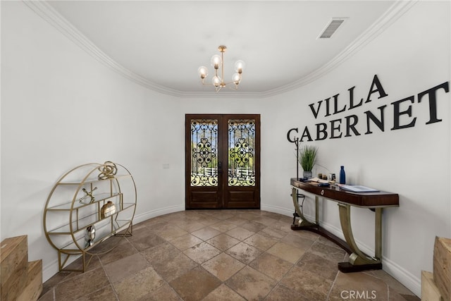 entrance foyer featuring french doors, crown molding, and a notable chandelier