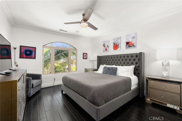 bedroom with crown molding, dark wood-type flooring, and ceiling fan