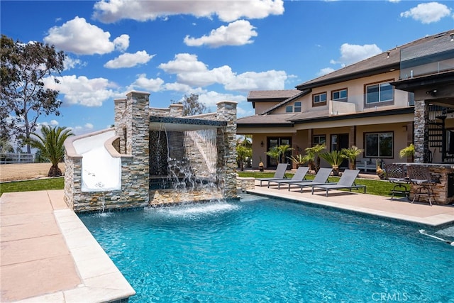 view of pool featuring a patio area