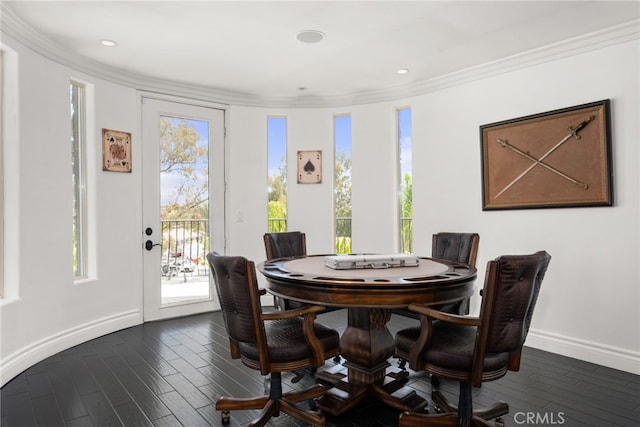 dining room with dark wood-type flooring and ornamental molding