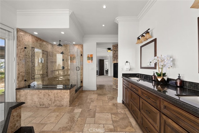 bathroom featuring ceiling fan, vanity, ornamental molding, and a shower with door