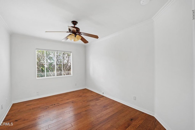 unfurnished room featuring ceiling fan, crown molding, baseboards, and wood finished floors