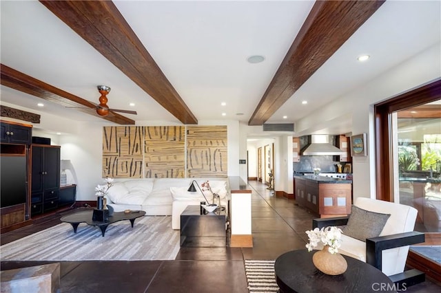 living area featuring a ceiling fan, recessed lighting, beam ceiling, and baseboards