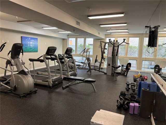 gym featuring visible vents and baseboards