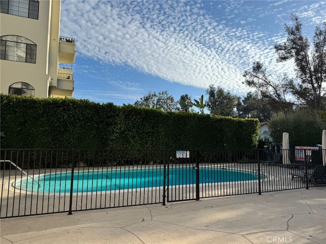 pool featuring fence