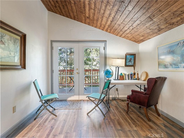 living area with lofted ceiling, french doors, wood finished floors, and wood ceiling