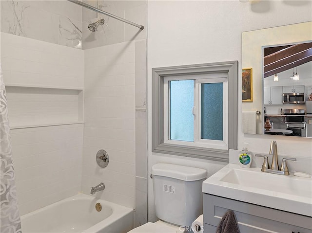 bathroom with vanity, toilet, and shower / bath combination with curtain