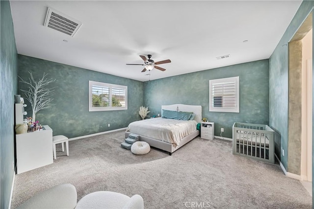 bedroom featuring carpet floors, visible vents, ceiling fan, and baseboards