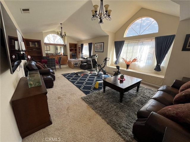 carpeted living room featuring a healthy amount of sunlight, lofted ceiling, and a notable chandelier