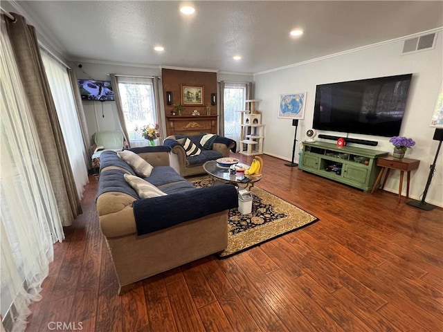 living room with crown molding and dark hardwood / wood-style floors