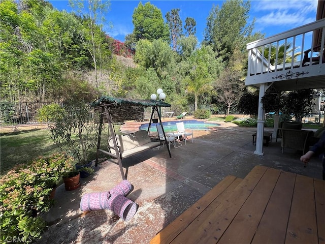 wooden deck with a patio area