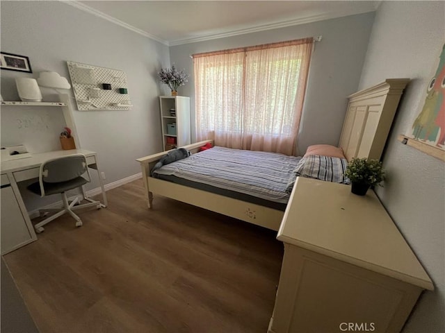 bedroom featuring crown molding and dark hardwood / wood-style flooring