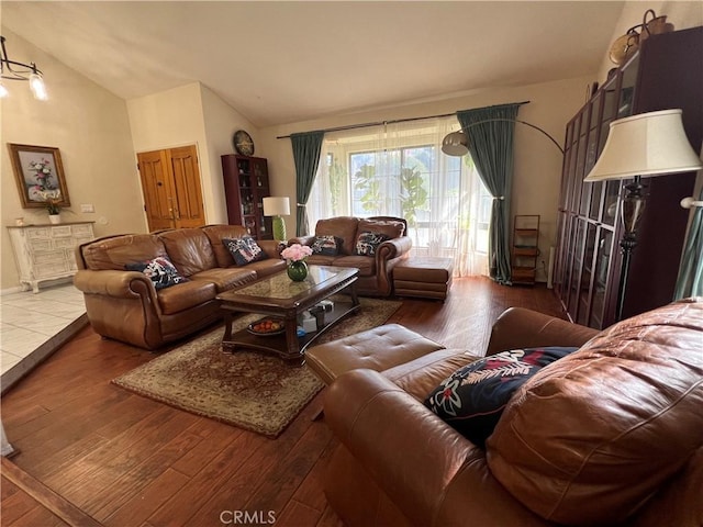 living room with wood-type flooring and lofted ceiling