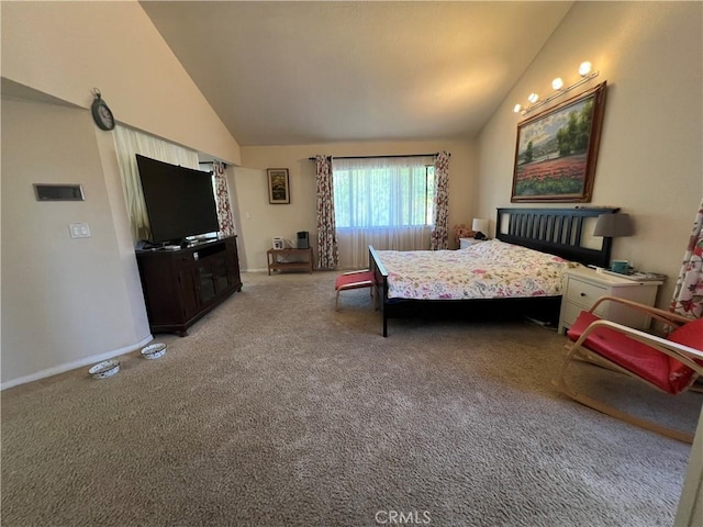 bedroom with high vaulted ceiling and carpet flooring