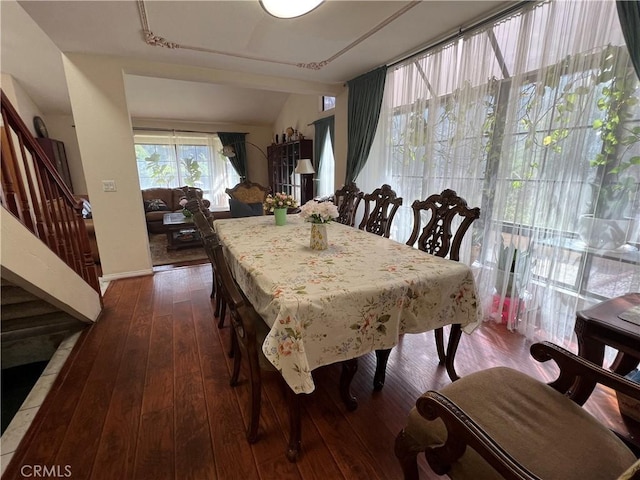 dining area with dark wood-type flooring