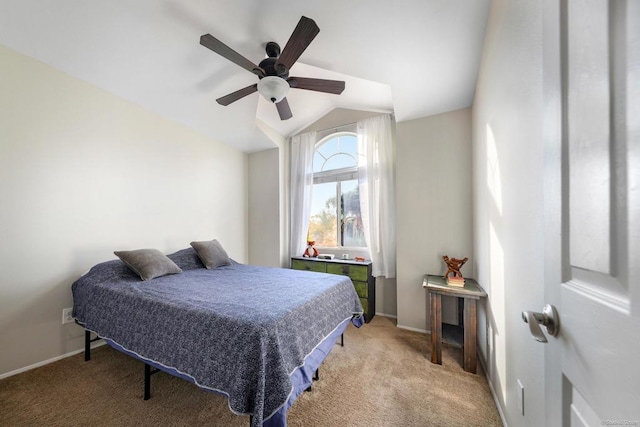 bedroom with lofted ceiling, light carpet, baseboards, and a ceiling fan