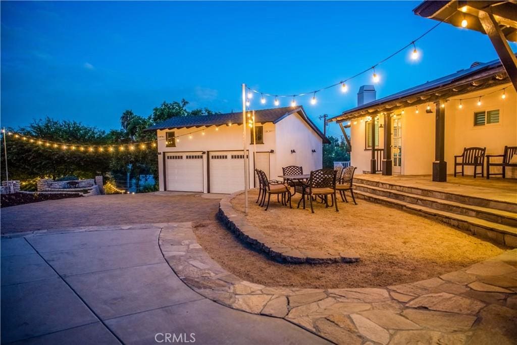 2900 San Juan Dr, Fullerton, CA 92835 - patio at twilight featuring driveway and an attached garage