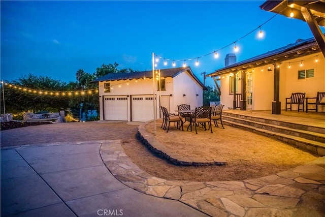 2900 San Juan Dr, Fullerton, CA 92835 - patio at twilight featuring driveway and an attached garage