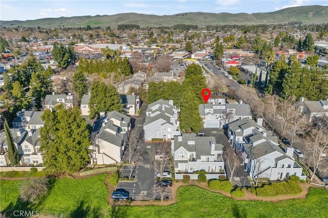 drone / aerial view featuring a mountain view and a residential view