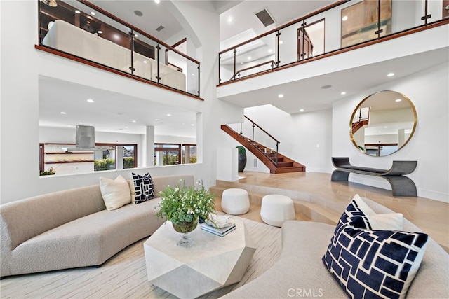 living room featuring a towering ceiling