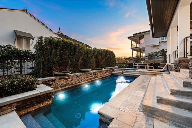 2907 Cliff Dr, Newport Beach, CA 92663 - pool at dusk with a patio
