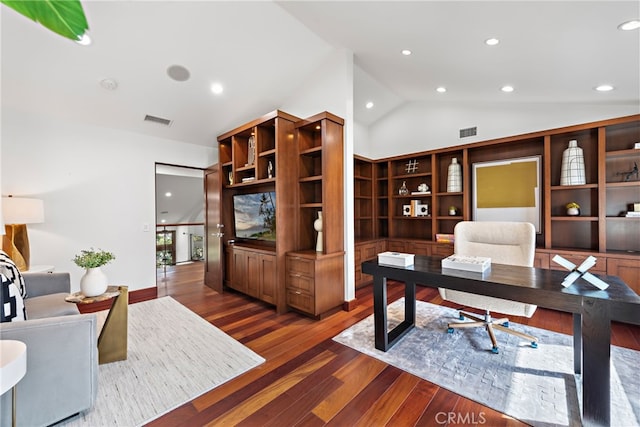 office featuring vaulted ceiling and dark hardwood / wood-style flooring