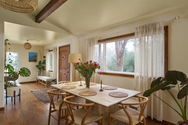 dining area with vaulted ceiling with beams and hardwood / wood-style floors