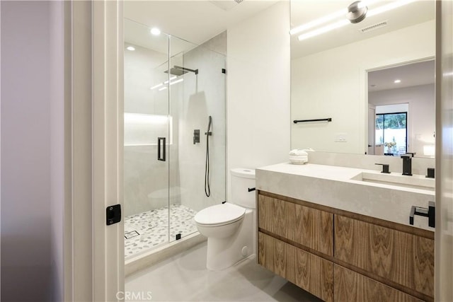 bathroom featuring toilet, recessed lighting, vanity, visible vents, and a stall shower