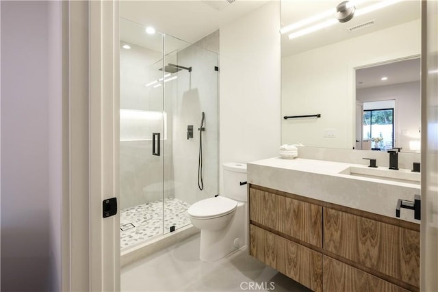 bathroom featuring visible vents, a stall shower, toilet, recessed lighting, and vanity