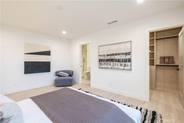 18848 Collins St, Tarzana, CA 91356 - bedroom with wood finished floors, recessed lighting, a spacious closet, baseboards, and ensuite bath