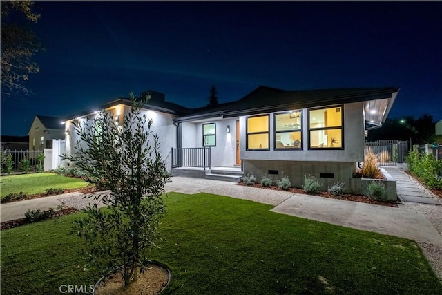 ranch-style house with a yard, crawl space, and fence