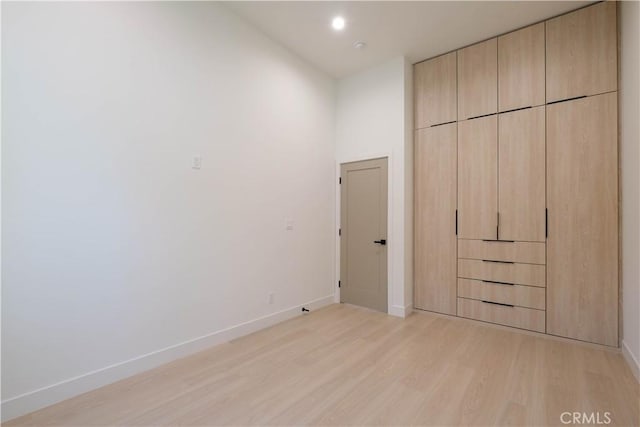 18848 Collins St, Tarzana, CA 91356 - unfurnished bedroom with light wood-style floors, baseboards, and recessed lighting