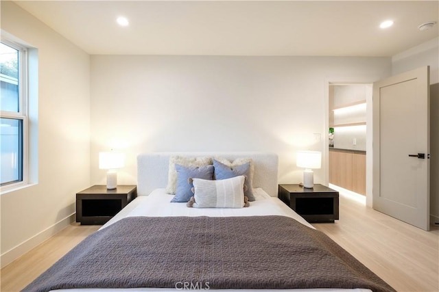 18848 Collins St, Tarzana, CA 91356 - bedroom with light wood finished floors, recessed lighting, and baseboards