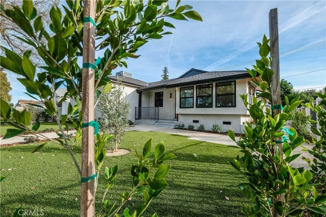 18848 Collins St, Tarzana, CA 91356 - back of property with crawl space, stucco siding, and a yard