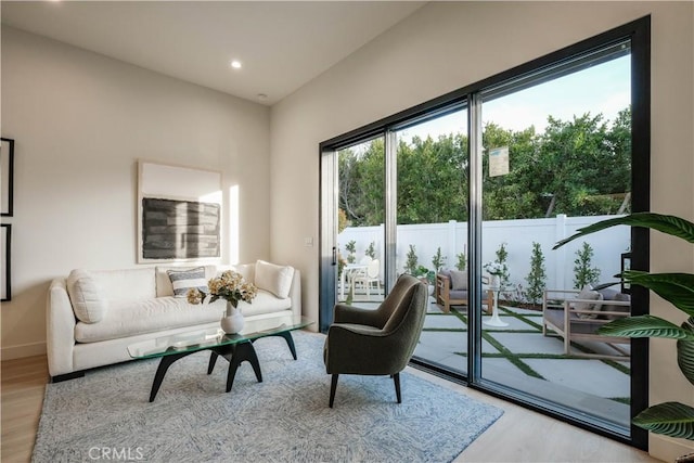 interior space with baseboards, recessed lighting, and wood finished floors