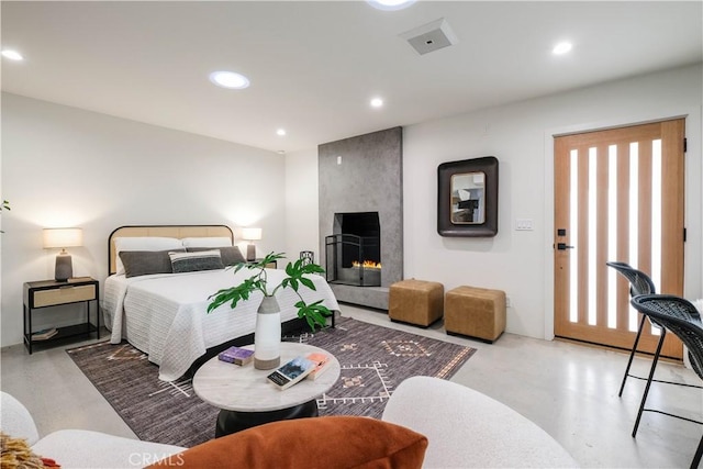 18848 Collins St, Tarzana, CA 91356 - bedroom featuring concrete flooring, recessed lighting, and a fireplace