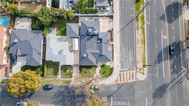 birds eye view of property with a residential view