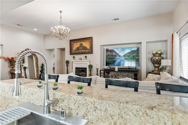 interior space with sink and a chandelier