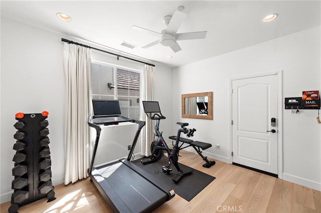 workout room with light wood-type flooring and ceiling fan