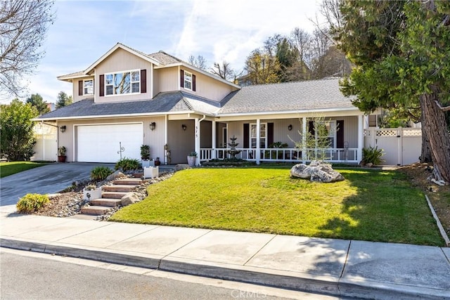 view of front property featuring a garage, a porch, and a front lawn