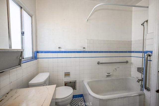 1314 E Harvard St, Glendale, CA 91205 - bathroom with toilet, tiled bath, tile walls, a wainscoted wall, and tile patterned floors