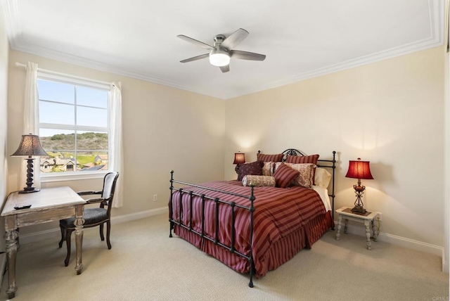 bedroom featuring ceiling fan, baseboards, crown molding, and light colored carpet