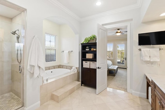 bathroom with a stall shower, ornamental molding, a garden tub, tile patterned flooring, and vanity